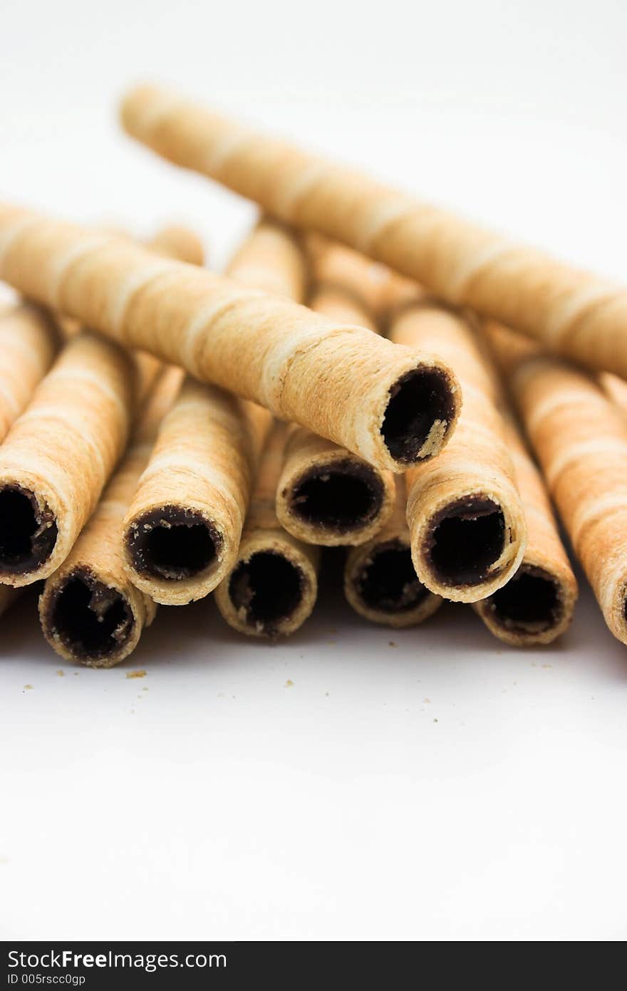 Belgian chocolate waffle sticks, shallow dof on white. Belgian chocolate waffle sticks, shallow dof on white