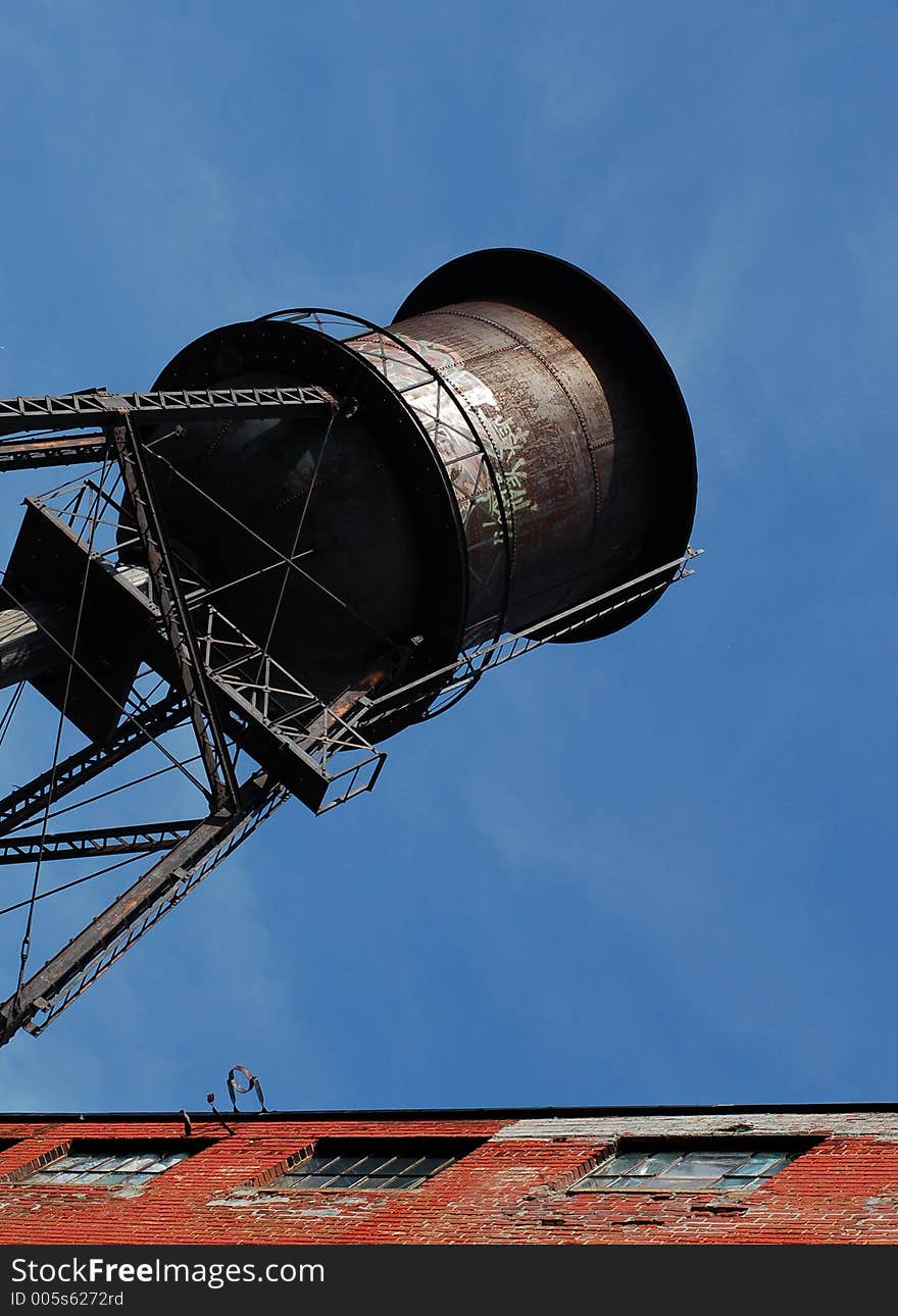 Old water tank beside lofts building in Montreal, Canada. Camera: Nikon D50 with portrait lens (50mm). Old water tank beside lofts building in Montreal, Canada. Camera: Nikon D50 with portrait lens (50mm).