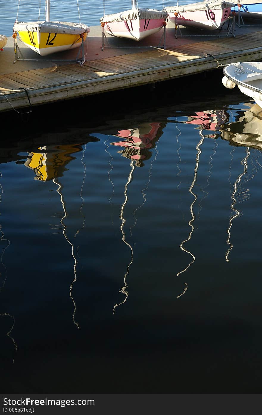 Sailboats in waiting along the charles river in boston