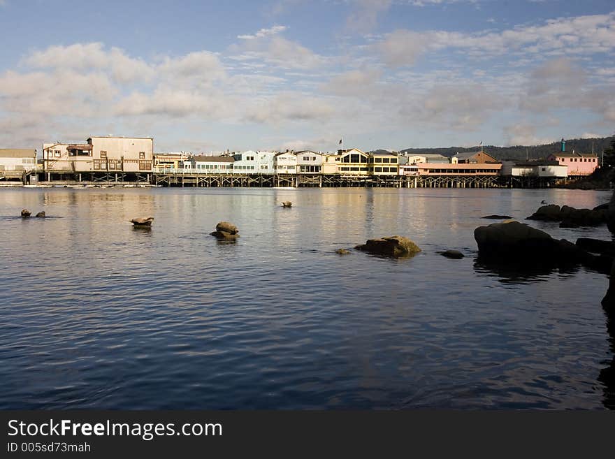 A pier with rocks in the foreground