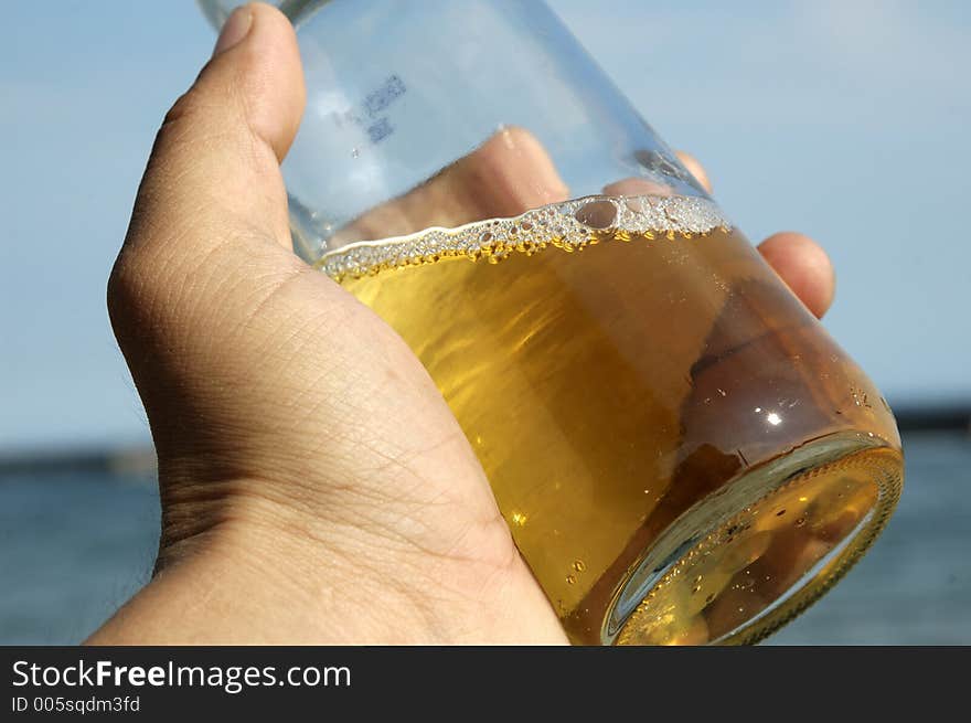 Beer bottle held in a hand