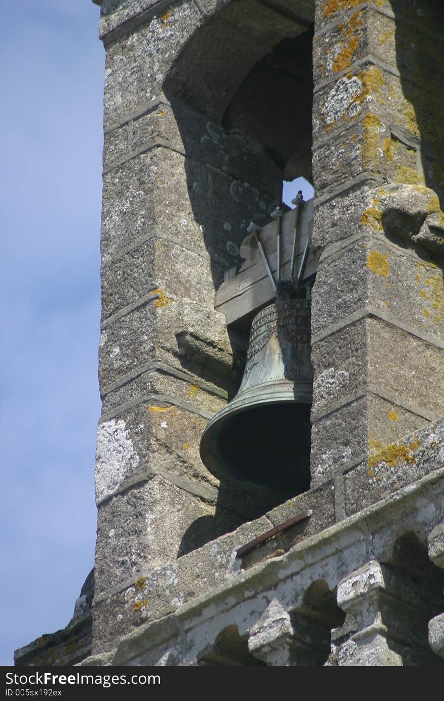 Old church bell in a clock tower of a very old French church