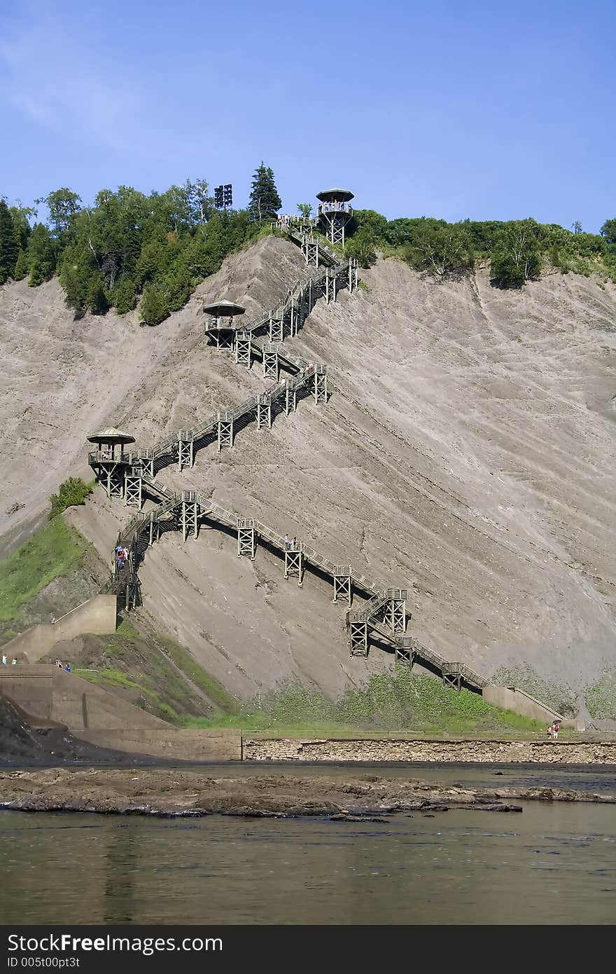 Located next to the Montmorency Falls in Quebec city, these wooden stairs allow hikers to climb up this very high cliff. Located next to the Montmorency Falls in Quebec city, these wooden stairs allow hikers to climb up this very high cliff.