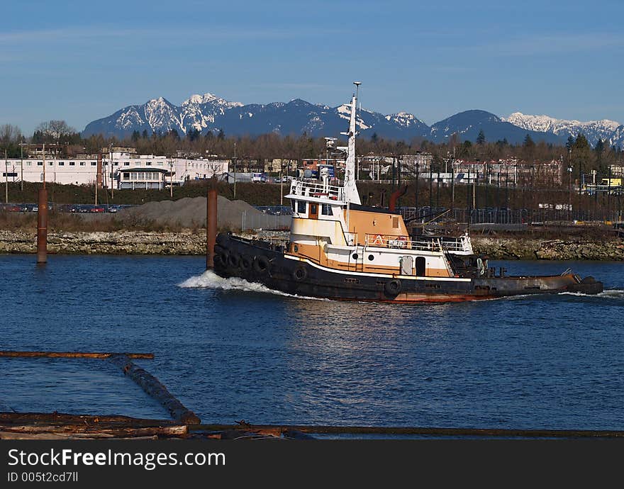 Tug moving up inner harbour in Richmond BC