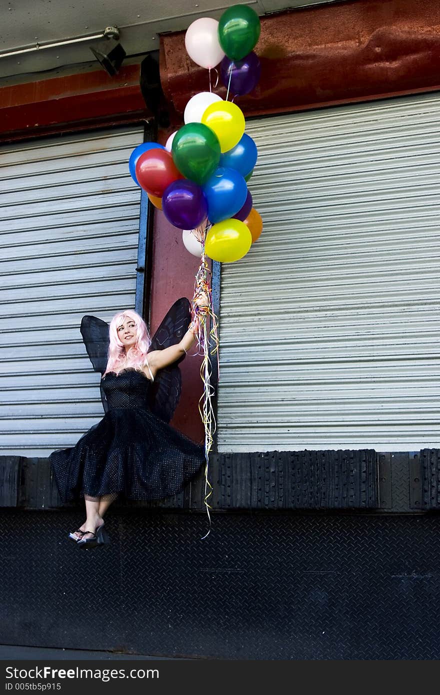 Fairy with balloons in an urban setting