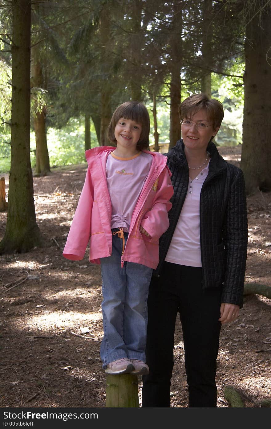 Mother and daughter in a wood