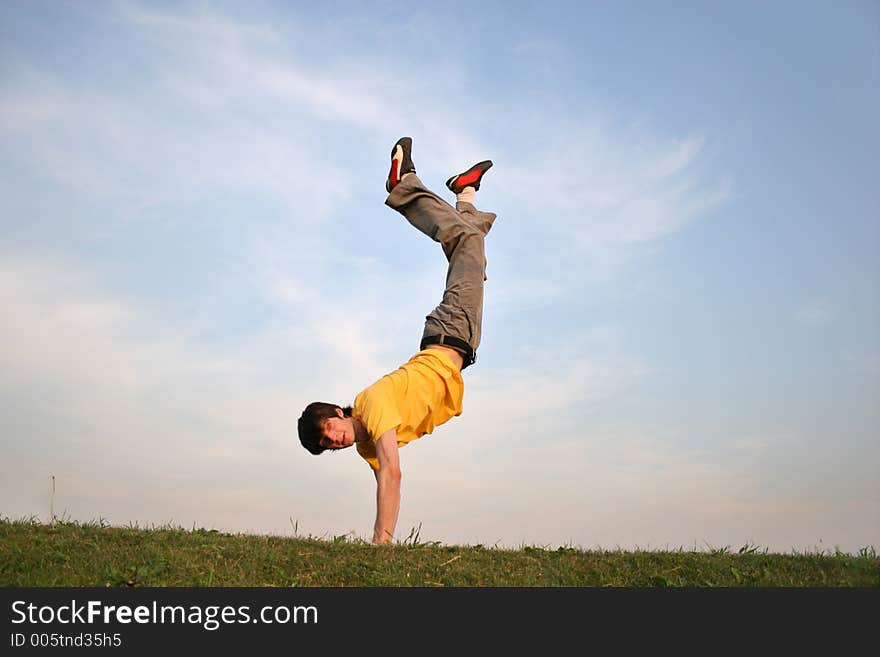 Boy on hands on meadow 4