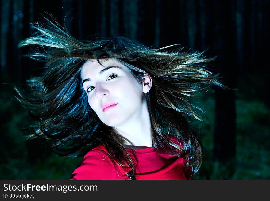 Woman shaking is hair (white balance ajusted in ps)