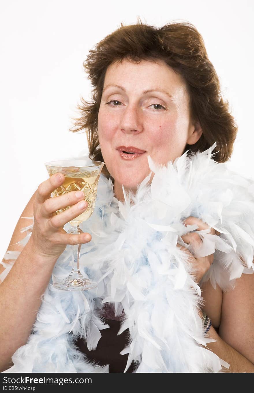 Lady wearing a boa and drinking champagne