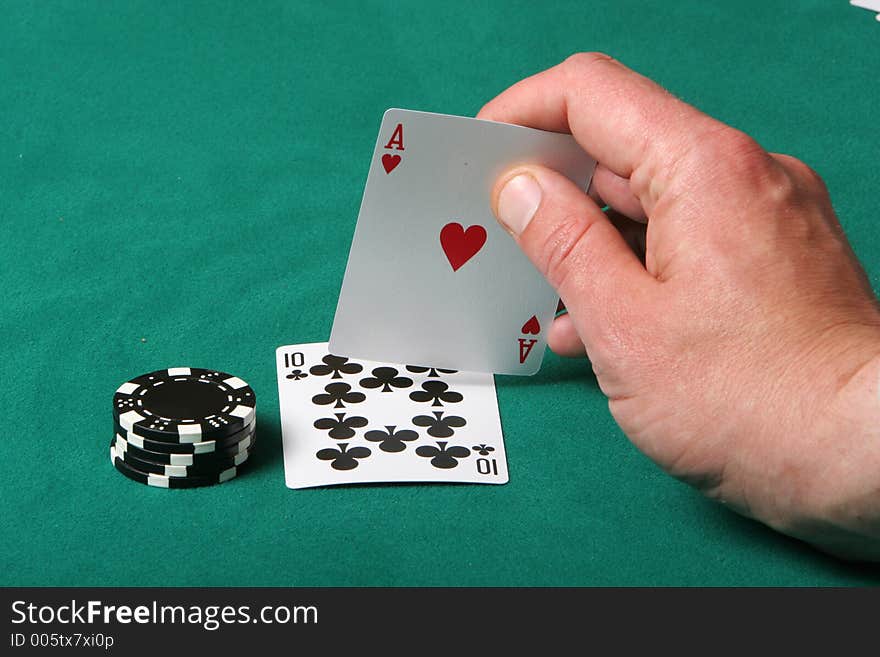 Cards in a black jack game, player checking his hand, getting a fantastic card. Cards in a black jack game, player checking his hand, getting a fantastic card