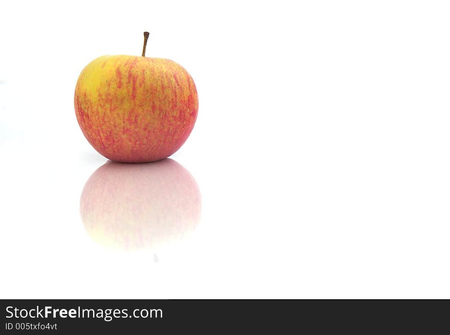 Red Apple isolated in a white background with reflection