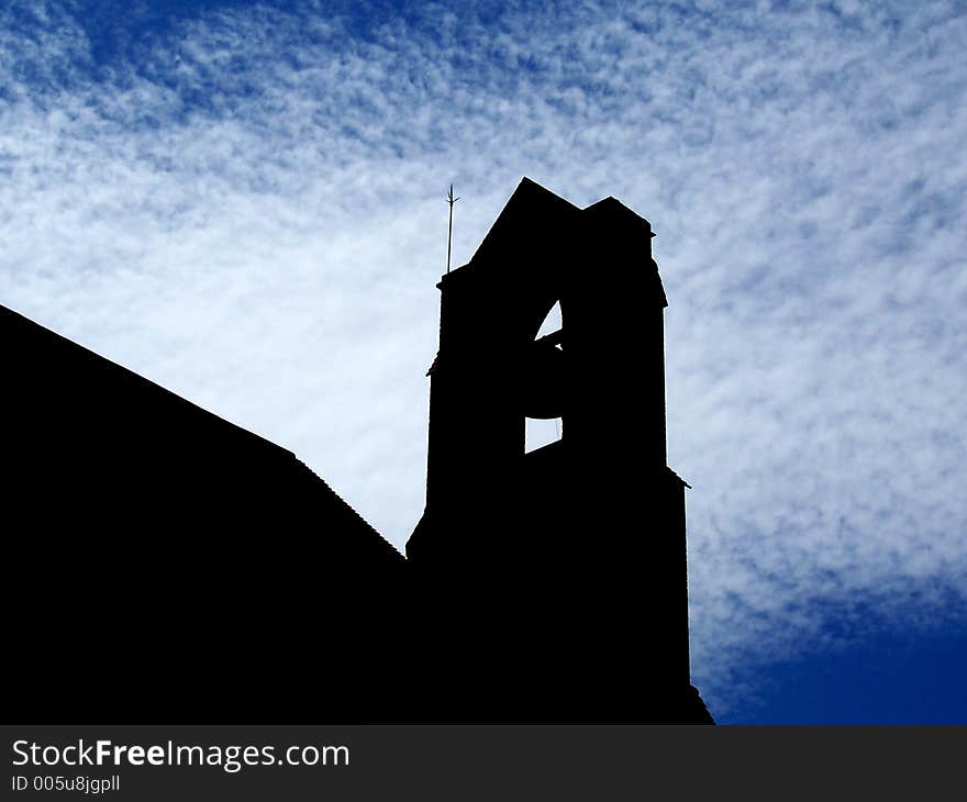 Silhouette of a church bell tower