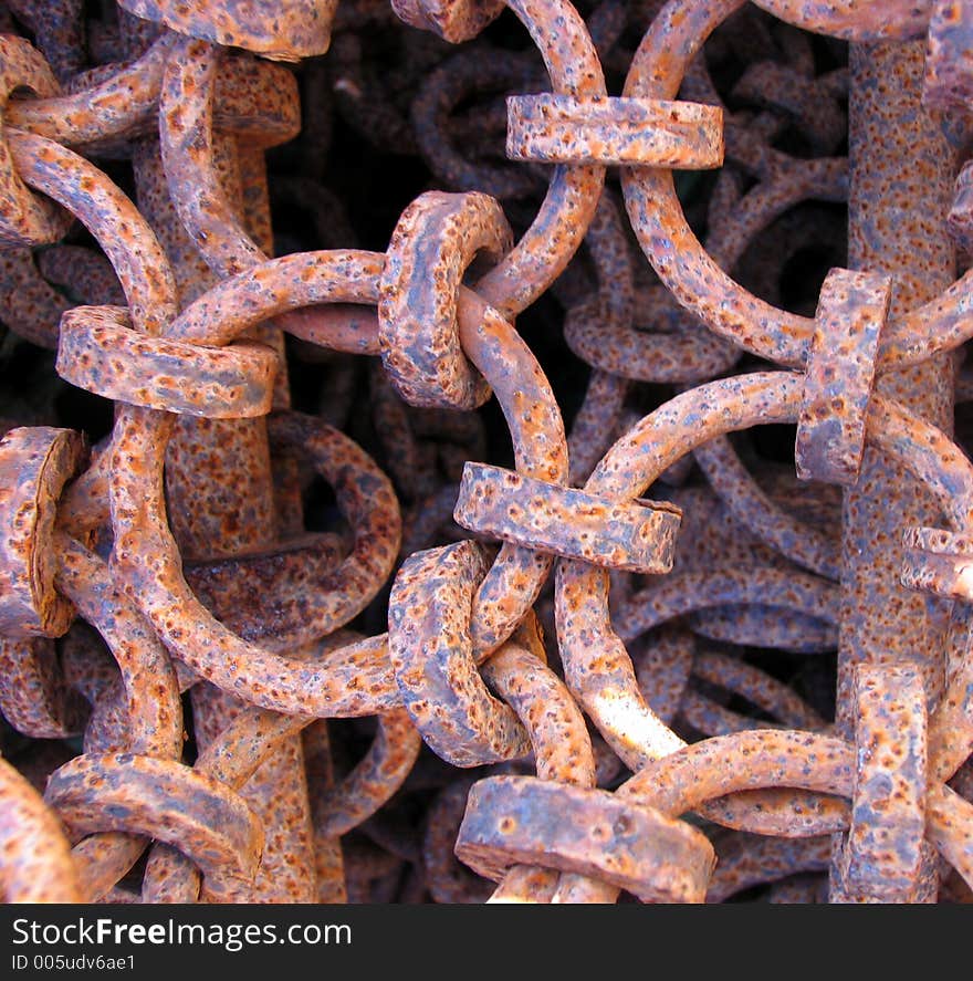 An old rusty metal dredger's net. An old rusty metal dredger's net