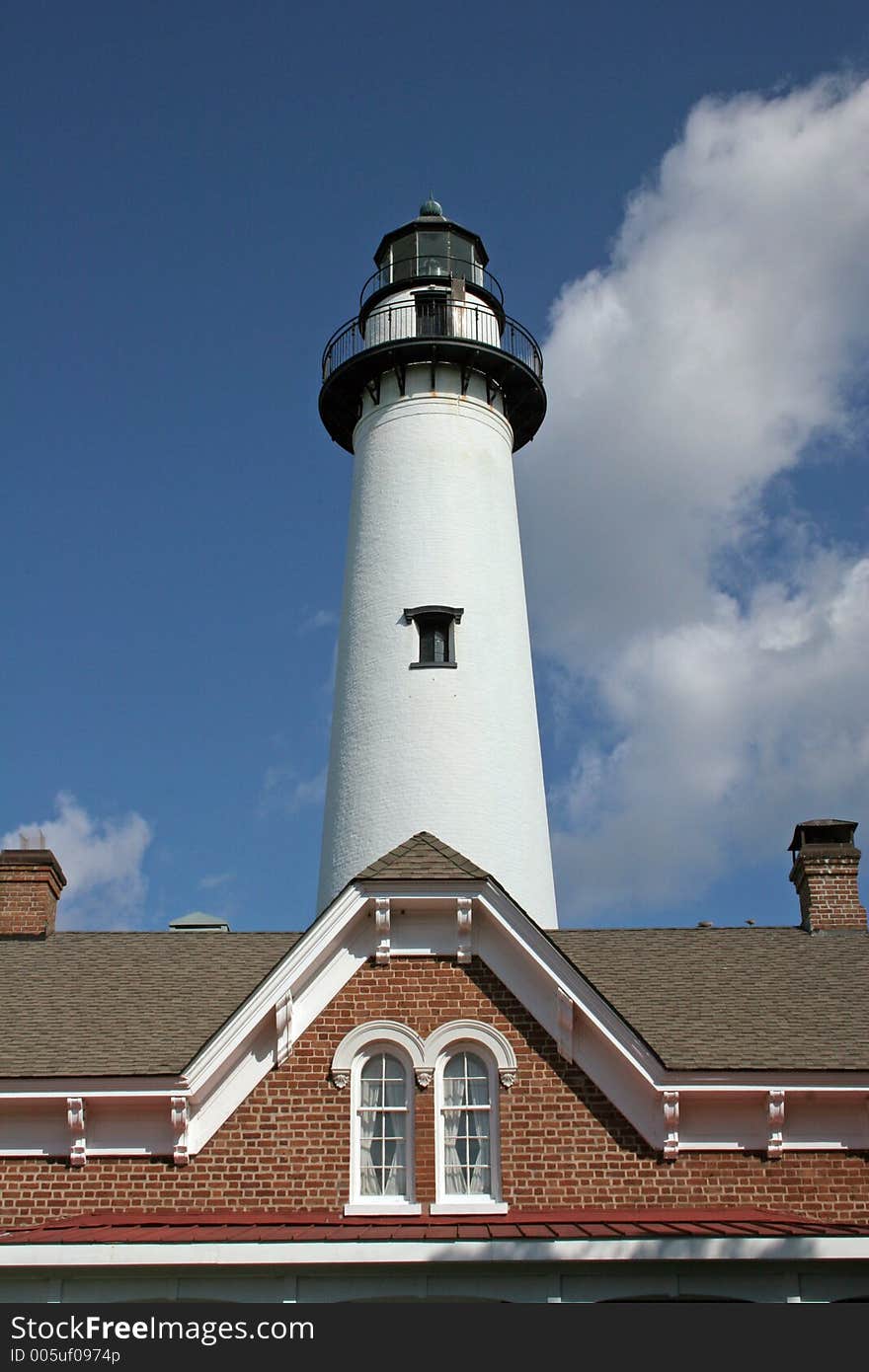 Lighthouse and roof of brick building