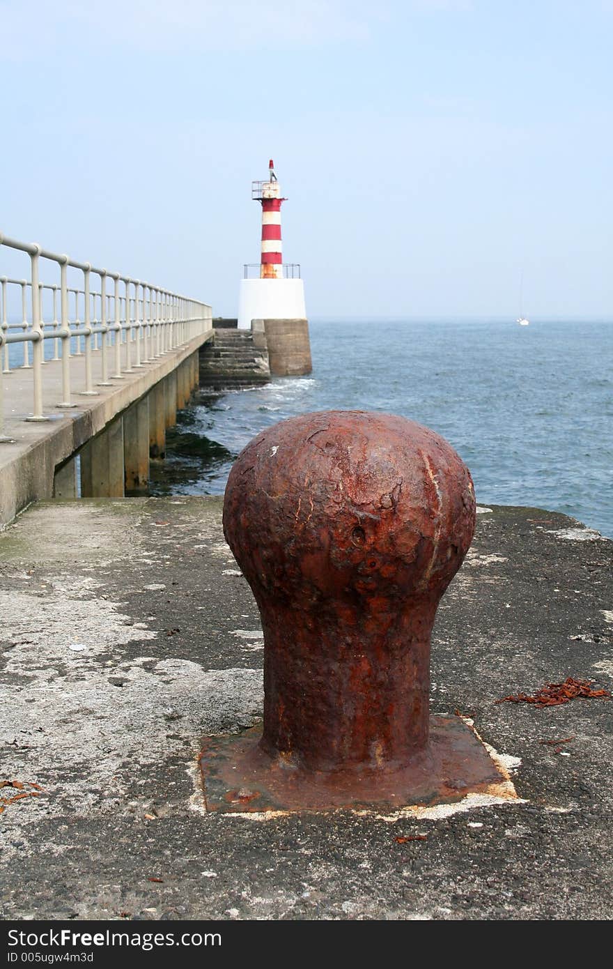 Ships and boats navigate their way inland by the red and white beacon and then can moor by tying their lines against these large bollards. Ships and boats navigate their way inland by the red and white beacon and then can moor by tying their lines against these large bollards