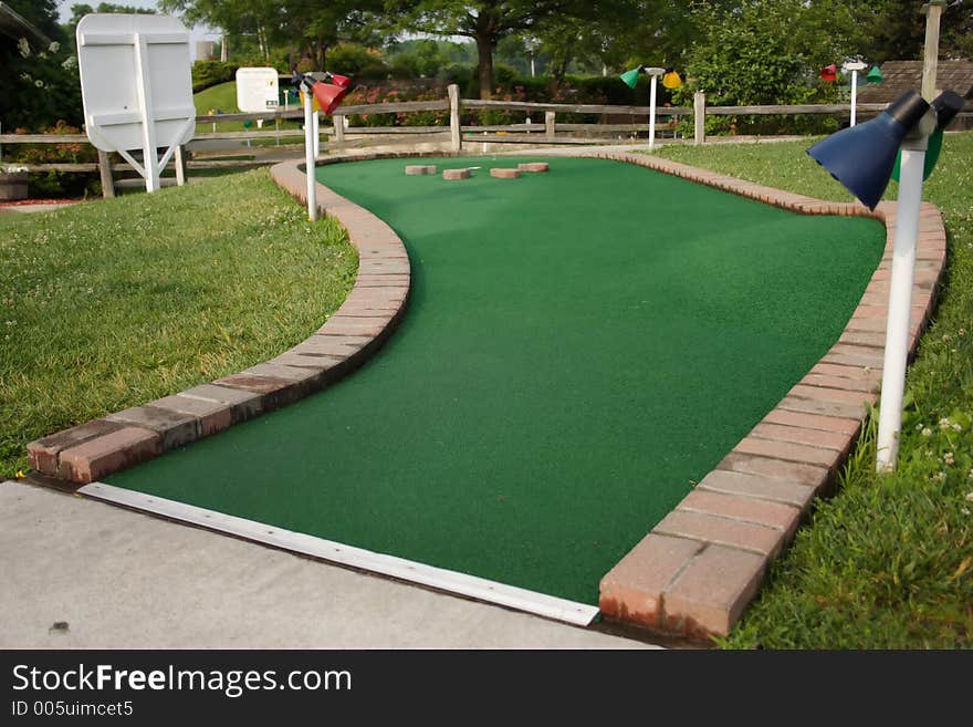 A hole at a miniature golf course. A hole at a miniature golf course