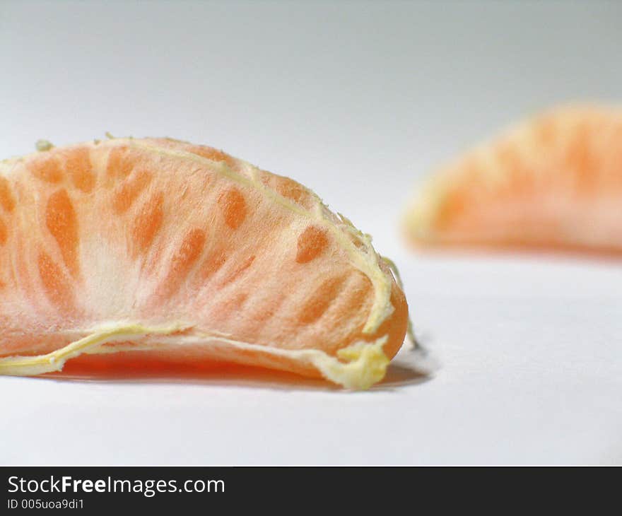 Two peeled mandarines on neutral background. Two peeled mandarines on neutral background