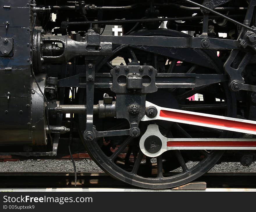 Front real and push rod of an ancient steam locomotive