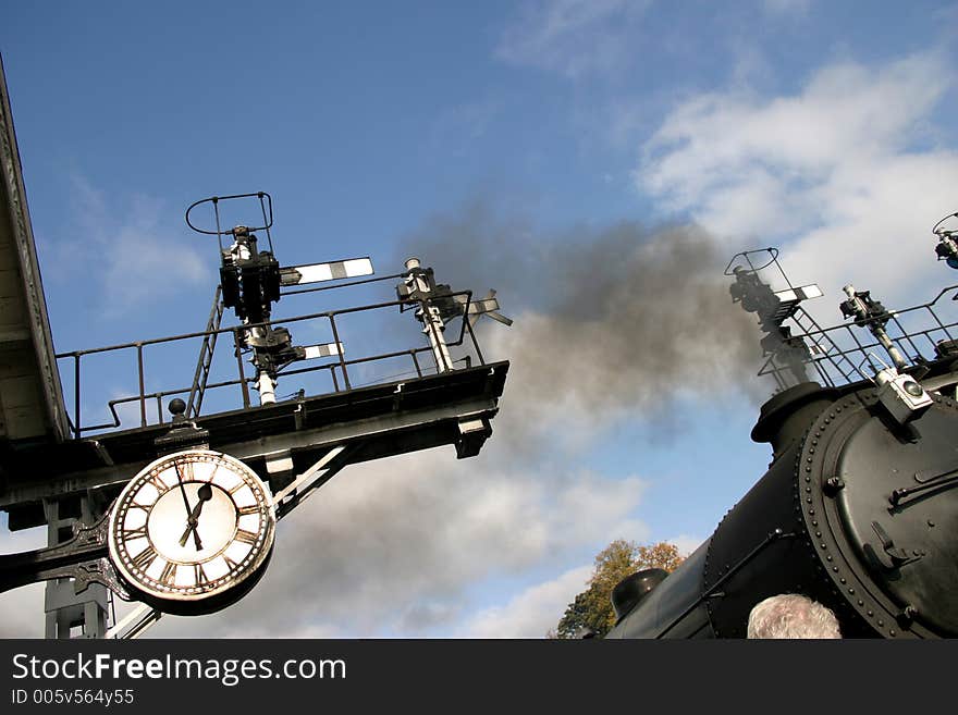 Steam Engine about to leave station on time. Steam Engine about to leave station on time