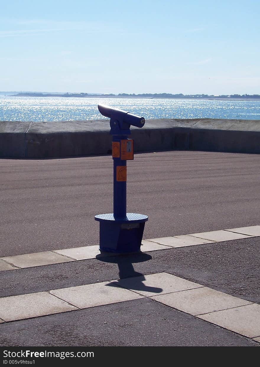 Telescope overlooking the ocean on a sunny day