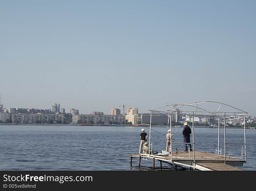 Four people on the fishing in city. Four people on the fishing in city