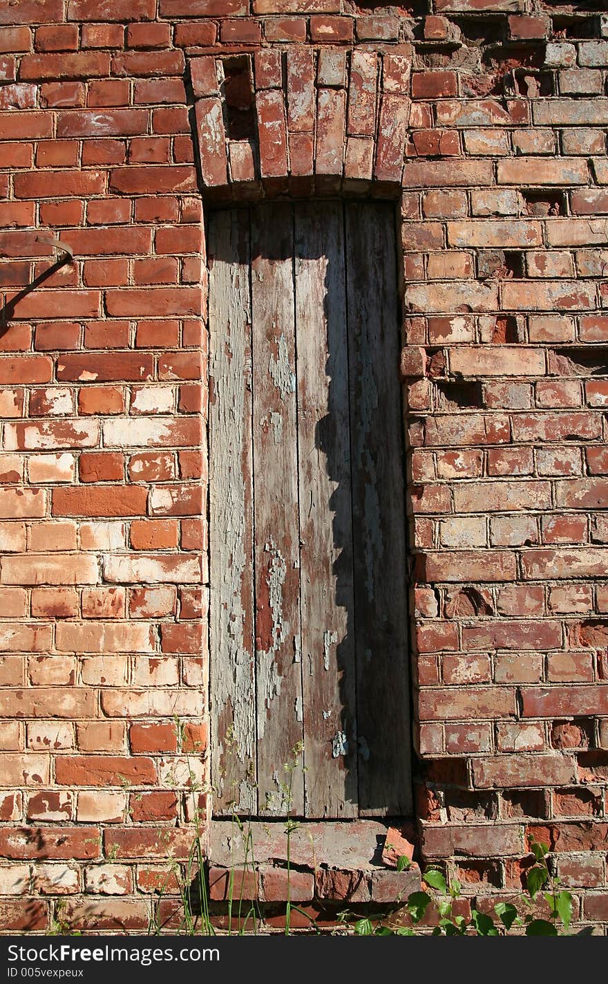 Old window in brick wall