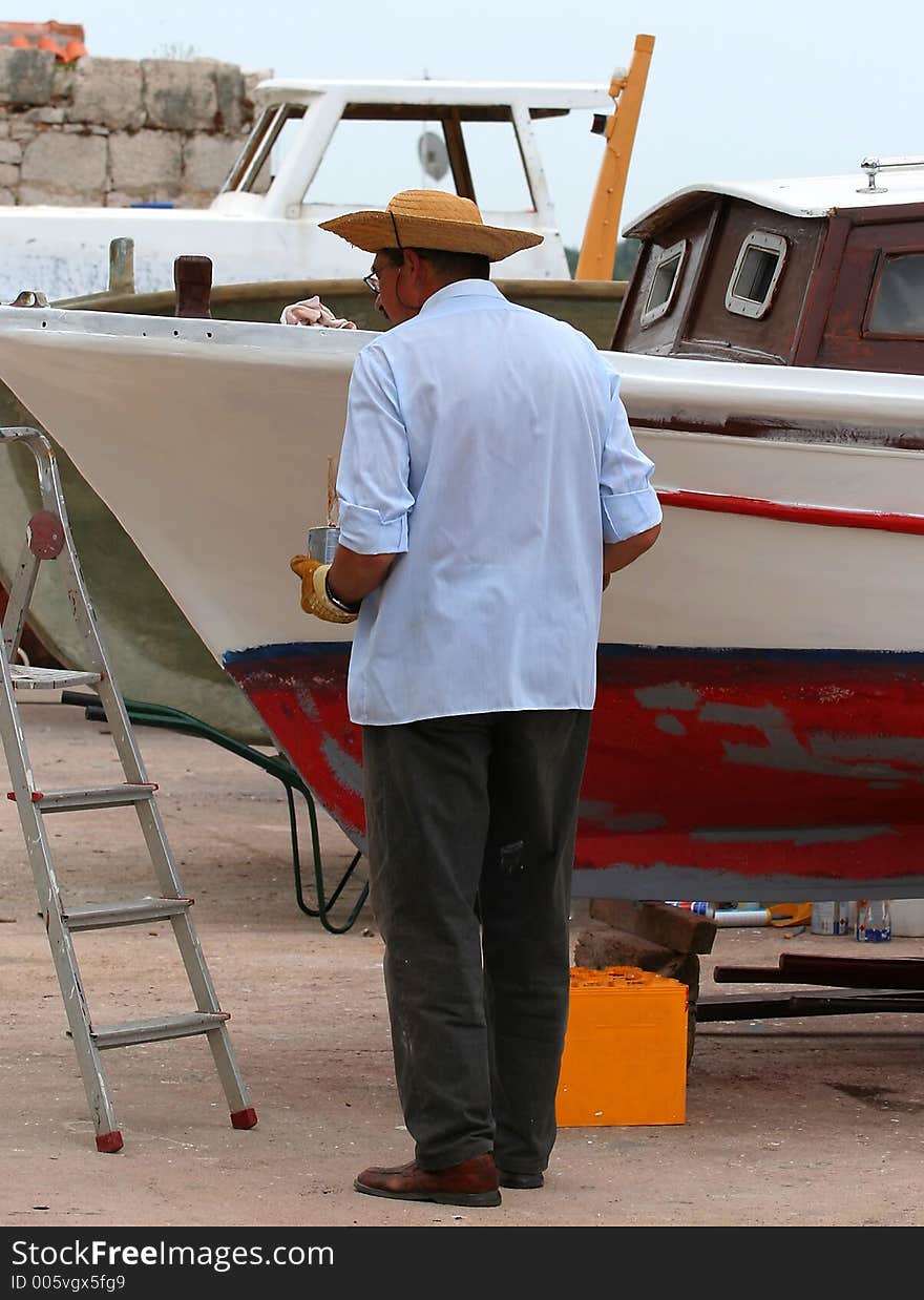 Man repairs a boat