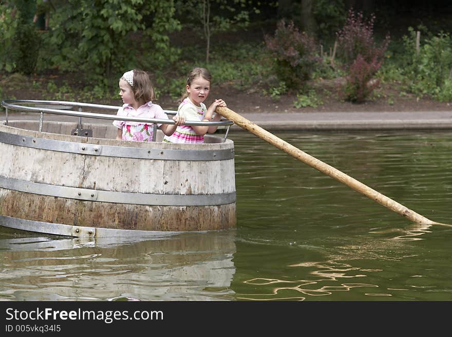 Twins Playing In A Barrel 03