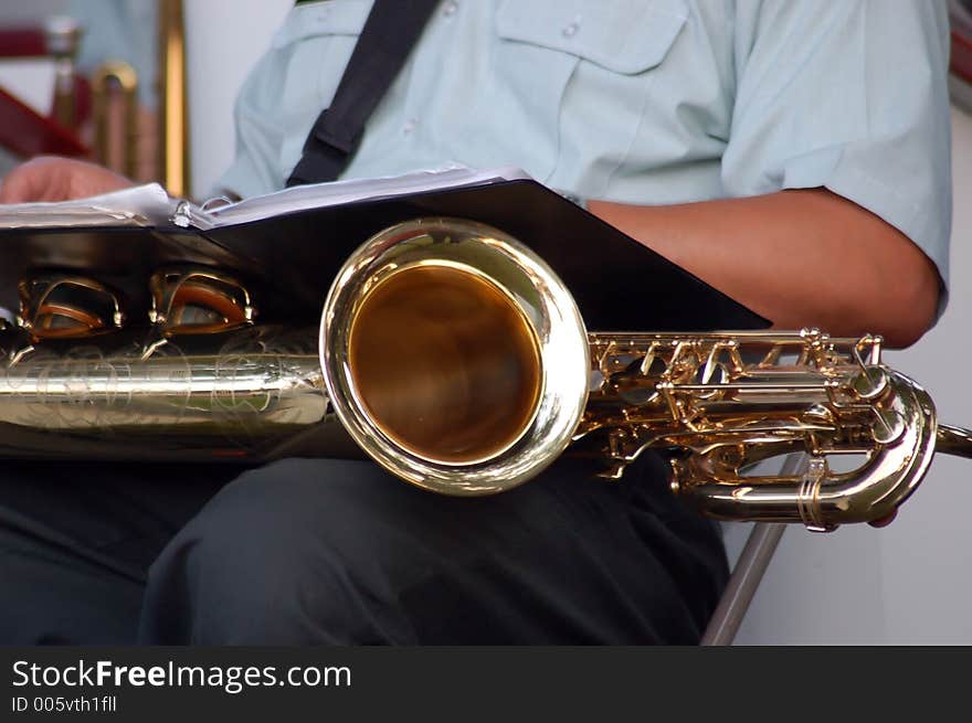 Baritone Sax player getting ready. Baritone Sax player getting ready