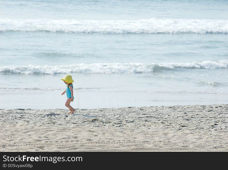 Young child playing in the sand. Young child playing in the sand.