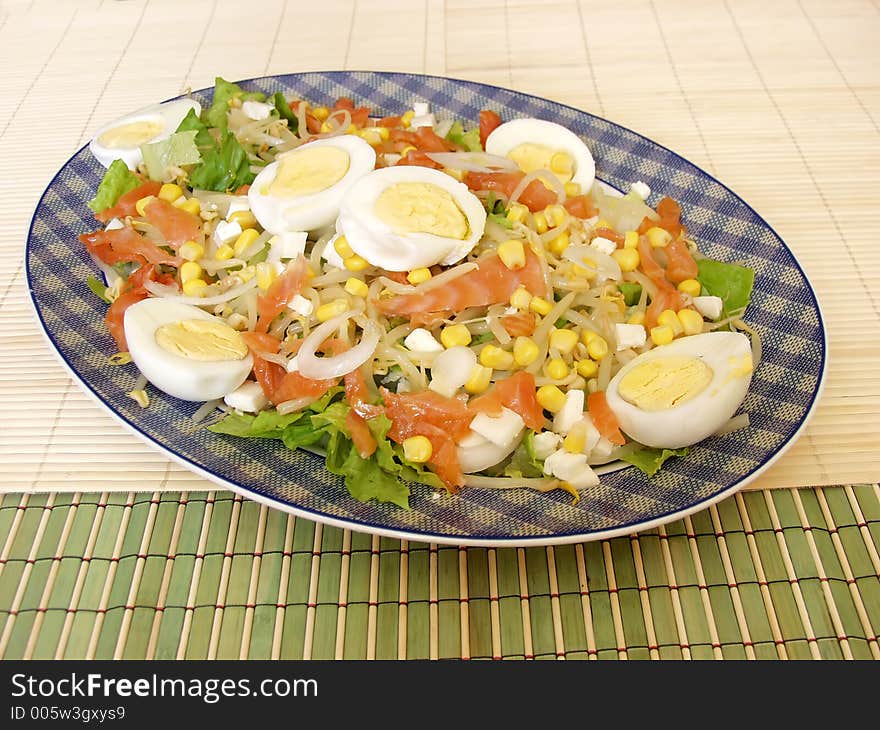 Healthy salad on a plate whit smoked salmon.