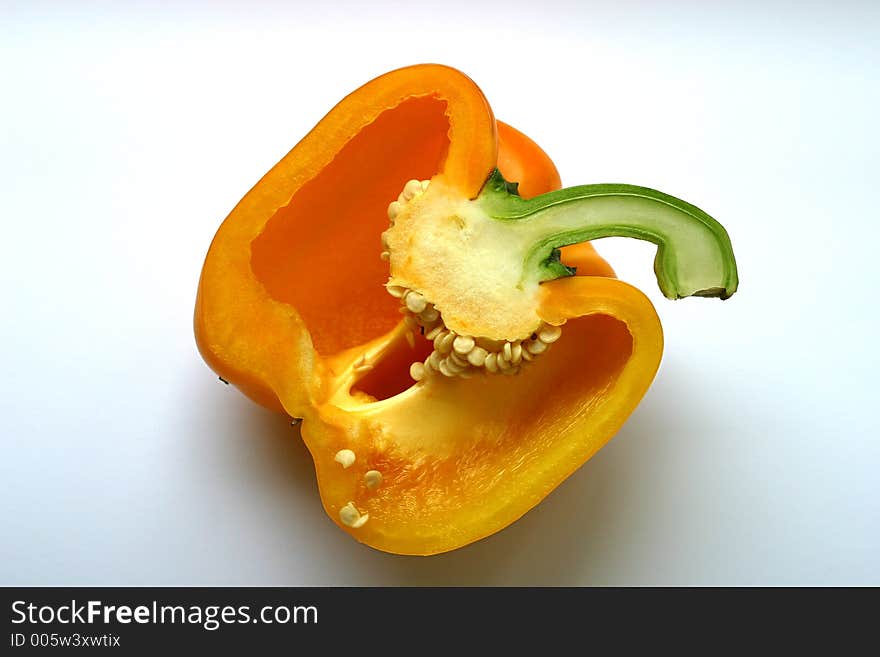 The yellow sweet pepper cut half-and-half. The yellow sweet pepper cut half-and-half
