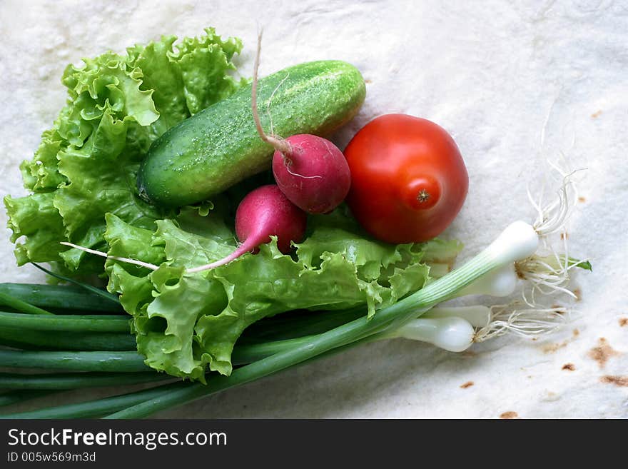 Vegetables on a unleavened wheat cake. Vegetables on a unleavened wheat cake