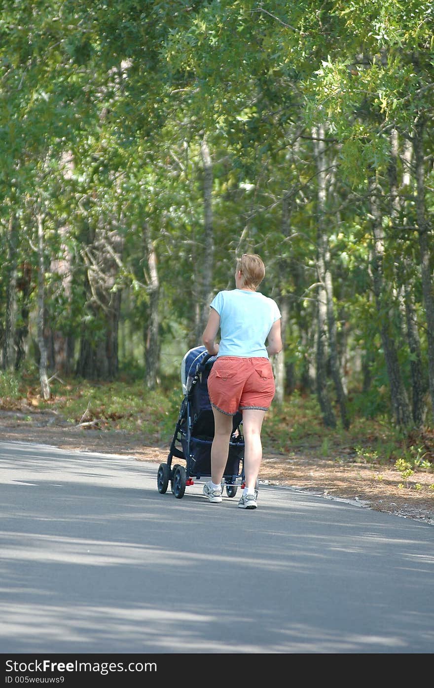 Mother & Child strolling the park. Mother & Child strolling the park.