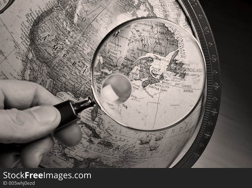 Globe and magnifying glass. Globe and magnifying glass