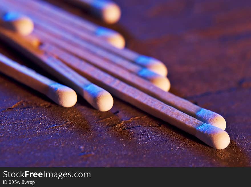 Matches laid out on an old piece of wood. Matches laid out on an old piece of wood