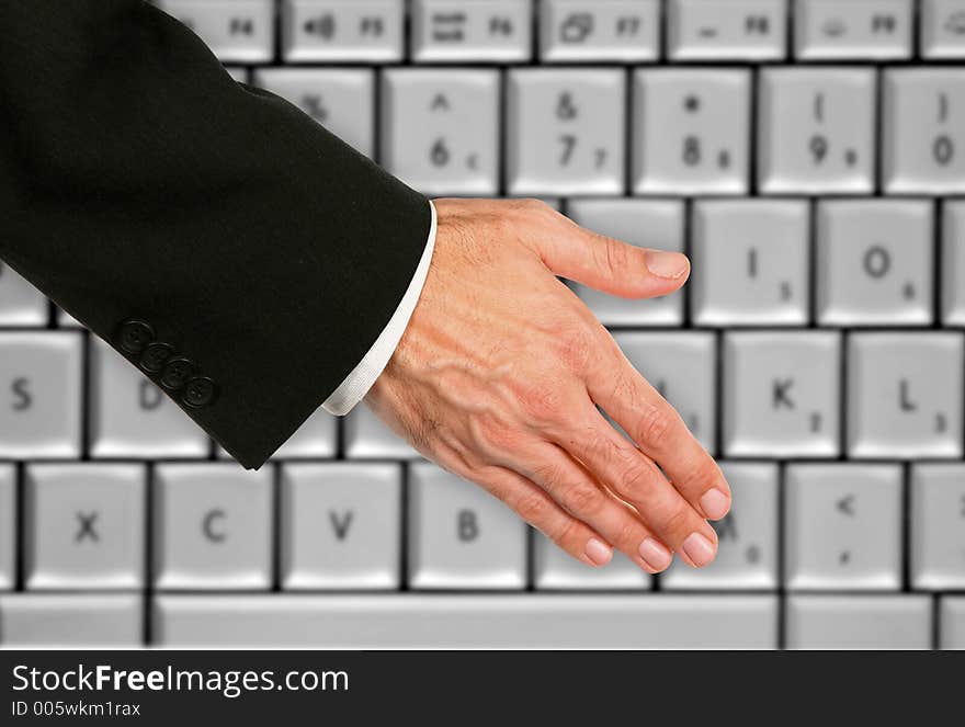 Hand Shake With Keyboard Background. Hand Shake With Keyboard Background