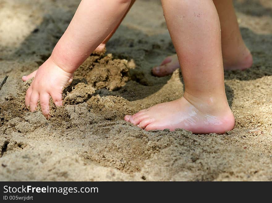 The boy plays sand on a beach. The boy plays sand on a beach