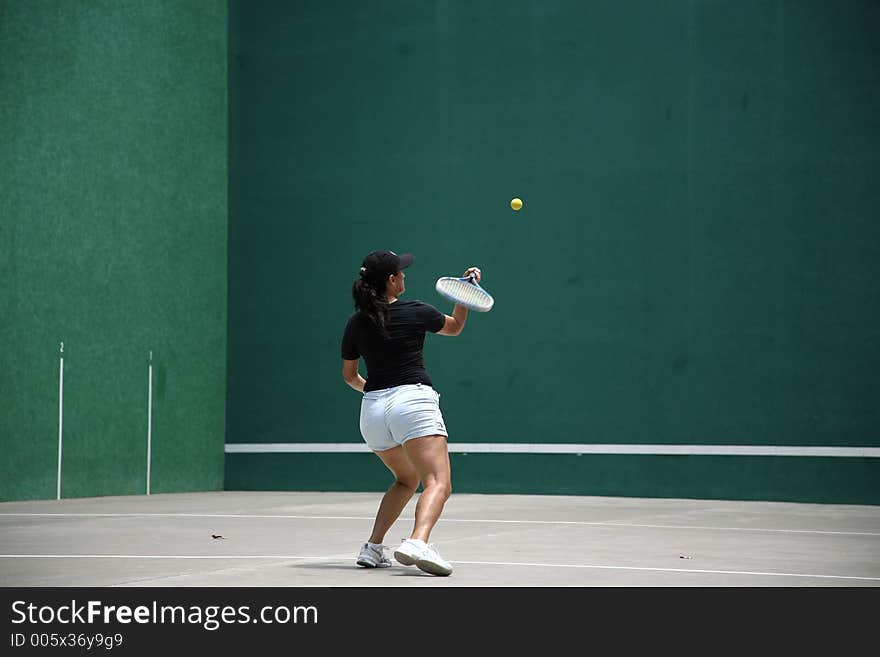 Woman playing fronton. Woman playing fronton