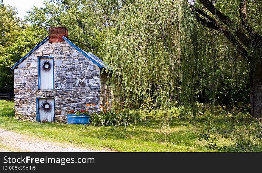 Small, two-story, stone bungalow or cottage beside a creek in Maryland. Small, two-story, stone bungalow or cottage beside a creek in Maryland