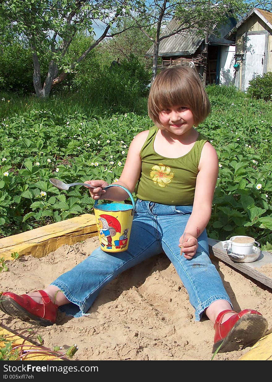 Girl In Sand-box