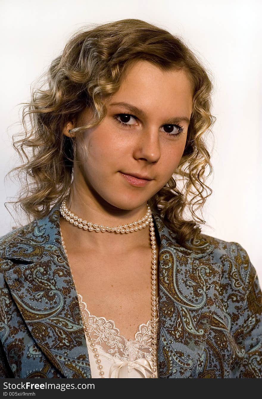 A portrait of a girl over white background. A portrait of a girl over white background