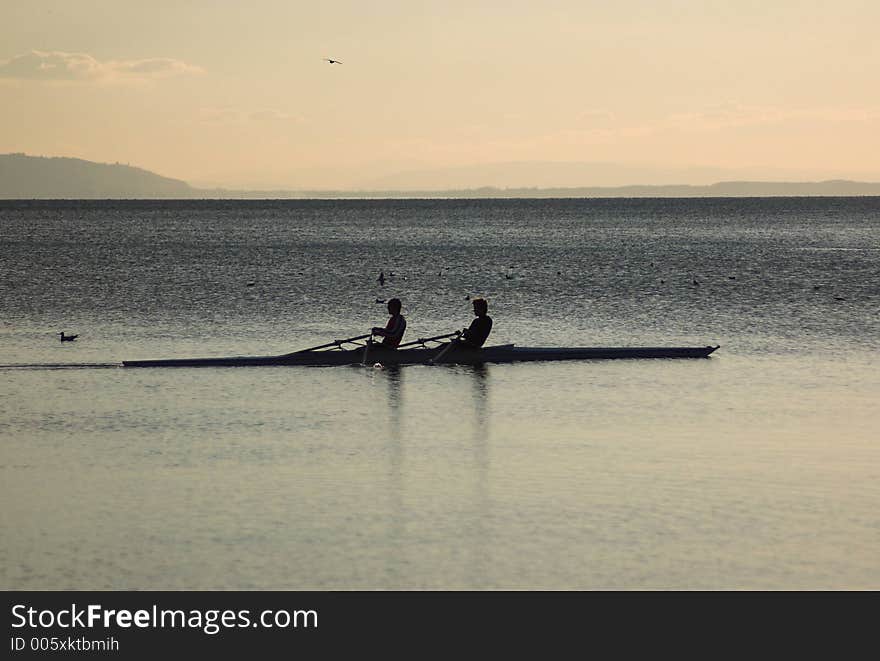 Rowers At Dusk