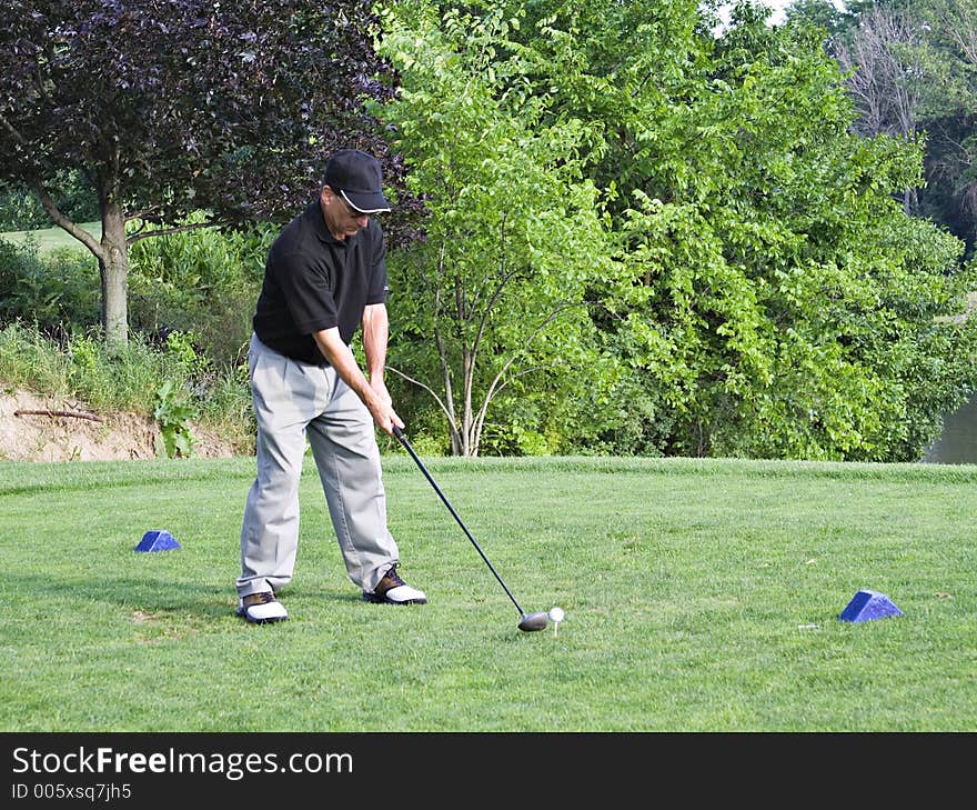 Man teeing off from the blue tees.