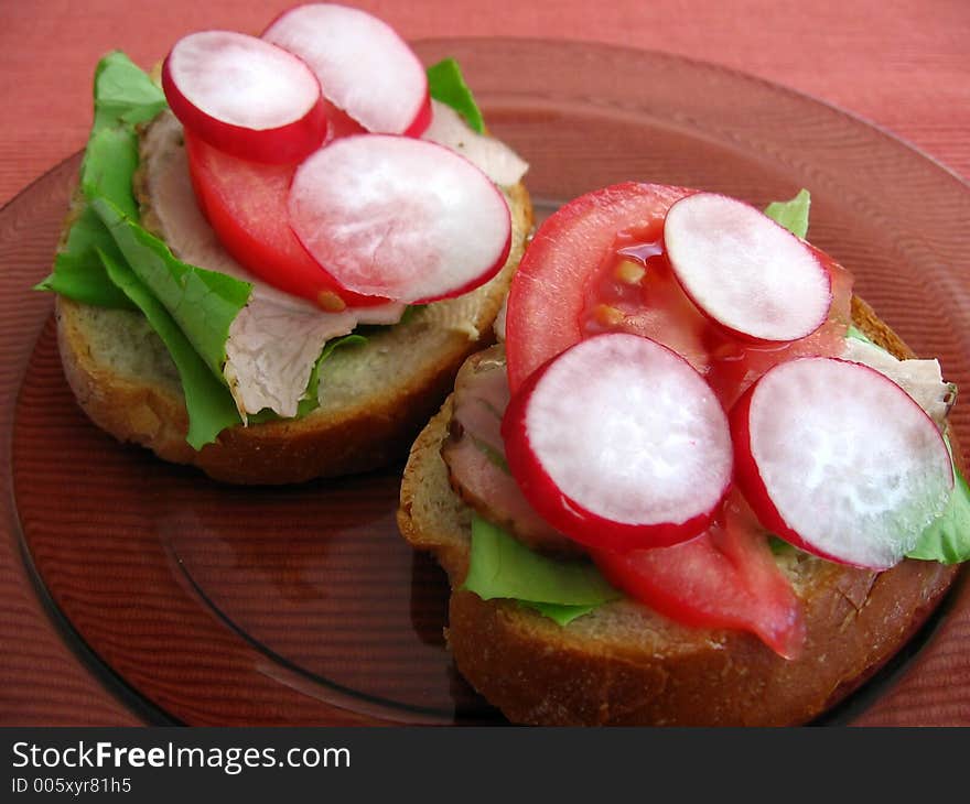 Fresh spring time sandwiches:

bread, butter, lettuce, pork, tomato, radish