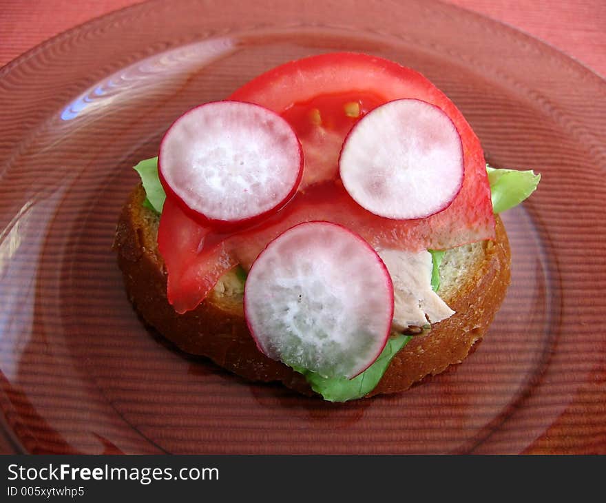 Fresh spring time sandwich:

bread, butter, lettuce, pork, tomato, radish