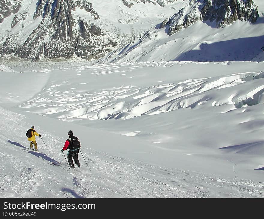 Snowboarder and Skier on the Vallee Blanche. Snowboarder and Skier on the Vallee Blanche