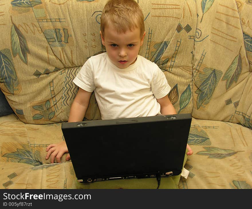 Boy with notebook at home