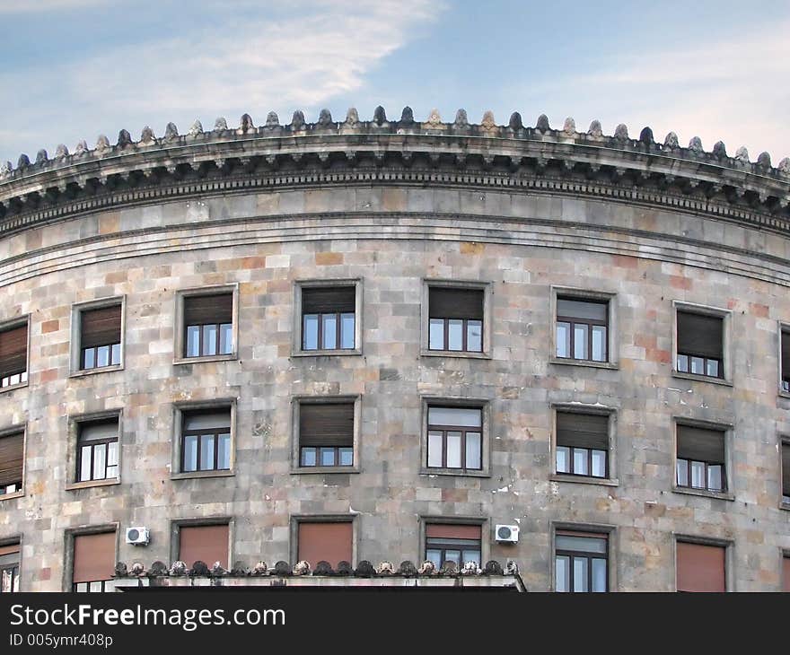 Round building wall with windows