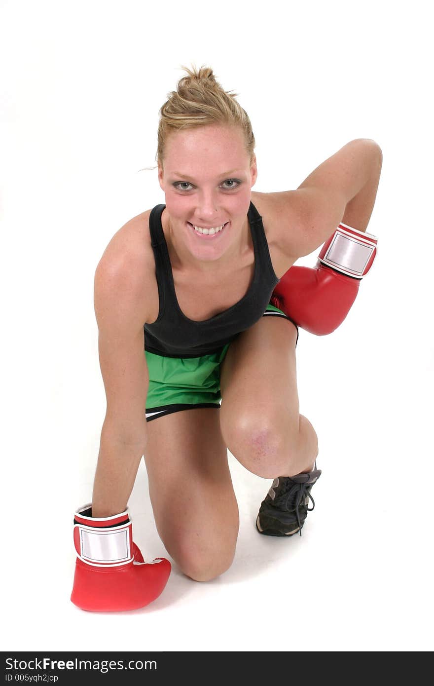 Young attractive blonde woman in boxing gloves. Young attractive blonde woman in boxing gloves.